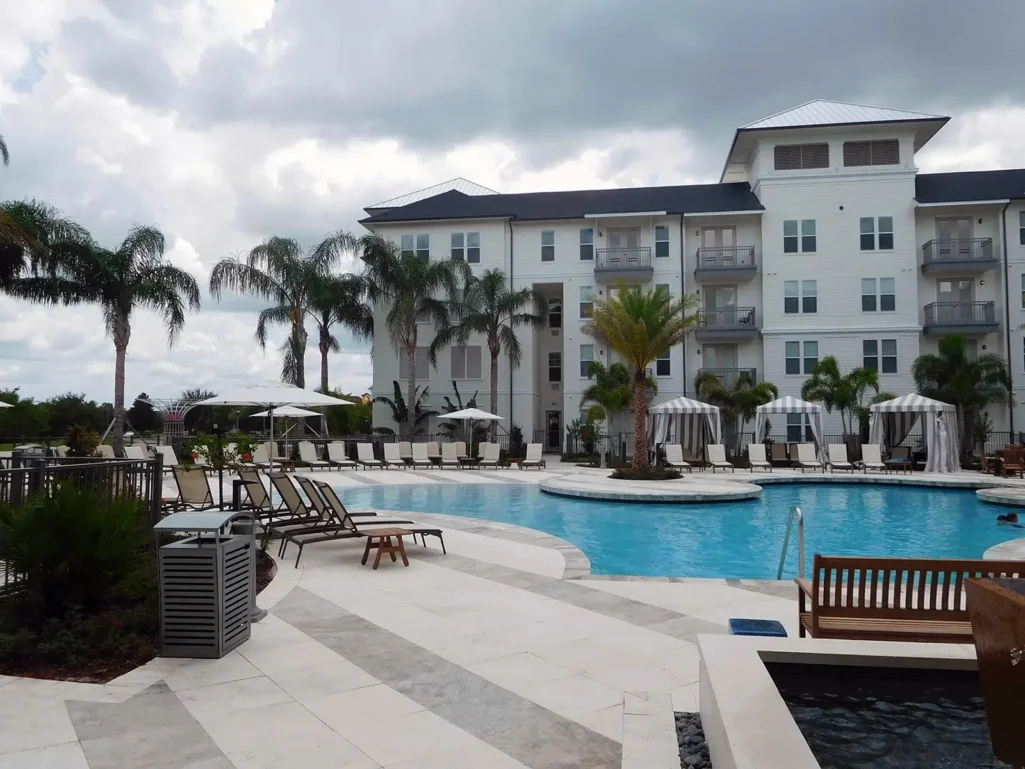 McLaren provided low rise new construction structural engineering services for Baldwin Harbor Apartments in Orlando, Florida. The picture shows a 4 story building and pool
