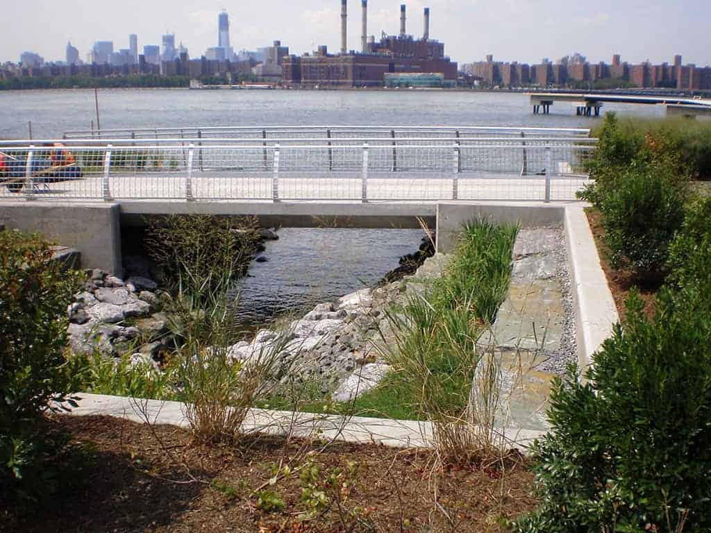 Pedestrian Bridge with Waterfront Rip Rap underneath at Transmitter Park