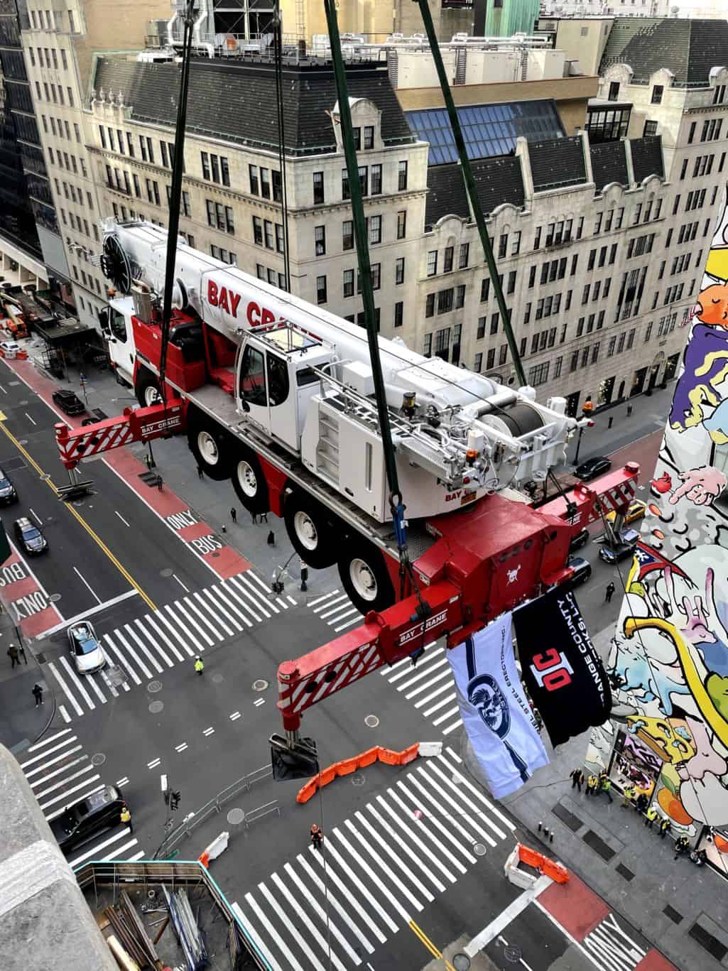Construction Crane ‘flies’ over NYC street to land atop Tiffany & Co.