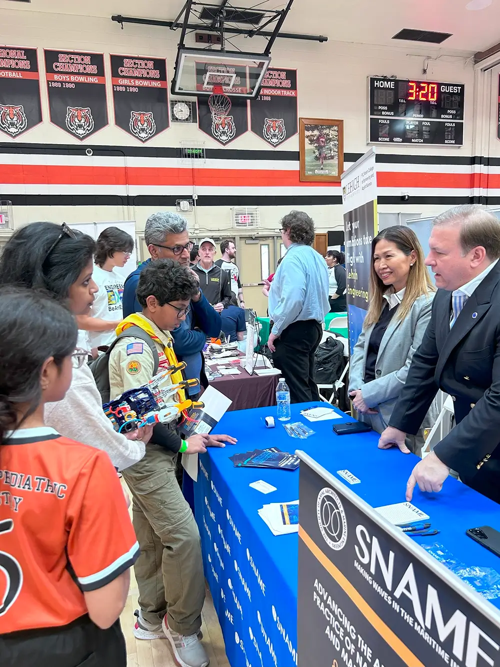 Students visiting a booth at the 2024 Engineering Expo
