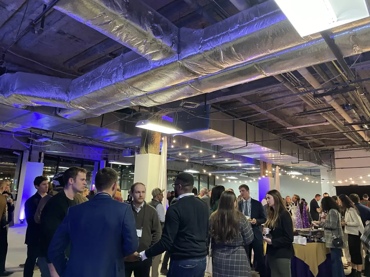 Industry professionals conversing at the ULI Baltimore Holiday party.